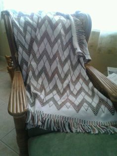 a chair with a blanket on top of it