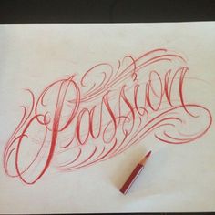 the word passion written in cursive writing on paper with a red marker next to it