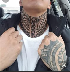 a man with tattoos on his neck and shoulder