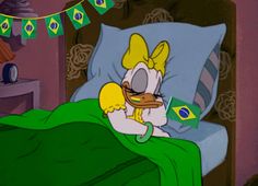 a cartoon character laying in bed with a green blanket