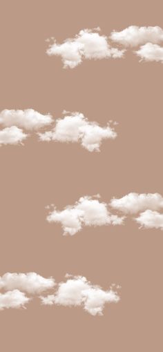 the sky is filled with white clouds on a brown background