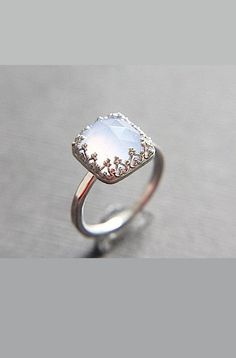 a ring with a white stone in the middle