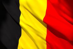 the flag of belgium is waving in the wind with black, yellow and red stripes