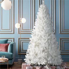 a white christmas tree in a living room