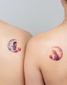 two women with small tattoos on their backs