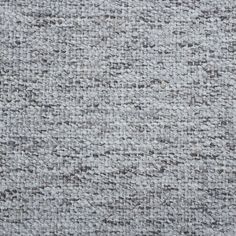 an up close shot of the texture of a carpet with grey and white colors on it