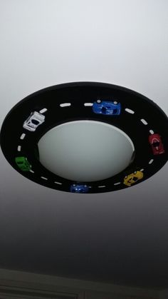 a ceiling light with cars painted on it