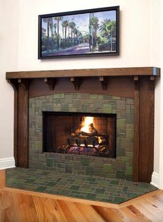 a fireplace with a painting on the wall above it