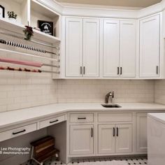 the kitchen is clean and ready to be used as a laundry room or office space