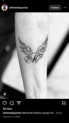 a black and white photo of a tattoo on someone's arm with the letter h