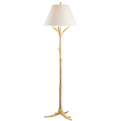 a gold tree lamp with a white shade