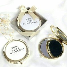 three different types of compact mirrors in a box on a white sheet with the caption you look gorgeous