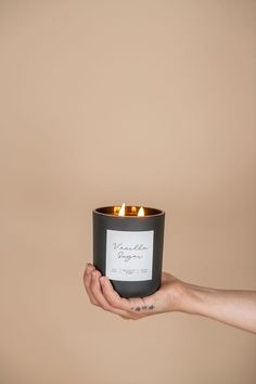 a person holding a candle in their hand that says, i am not sure if it is