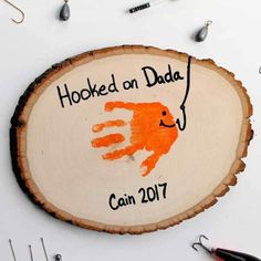 a wooden sign that says hooked on dad can 2011