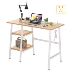 a laptop computer sitting on top of a wooden desk next to a lamp and potted plant