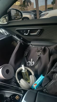 the inside of a car with headphones and other items