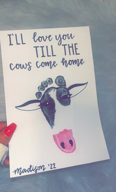 a hand holding up a card with a cow's face and the words, i'll love you till the cows come home