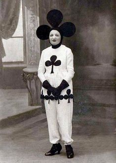 an old black and white photo of a boy in mickey mouse costume