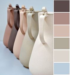 four vases with different shades of brown, pink, blue and grey on them