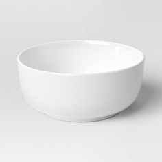 a white bowl is sitting on the table