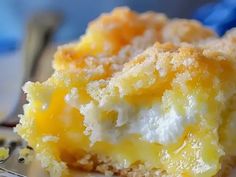 a close up of a piece of cake on a plate with a fork next to it