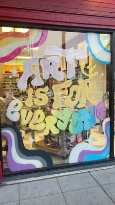 a store front window with the words happy new year painted on it