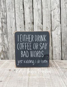 a sign that says i either drink coffee or say bad words