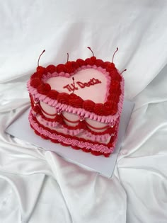 a heart shaped cake with two hearts on it