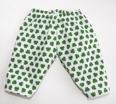 the pants are green and white with shamrocks on them, as if they were made out of fabric