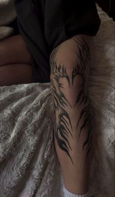 a person with a tattoo on their leg