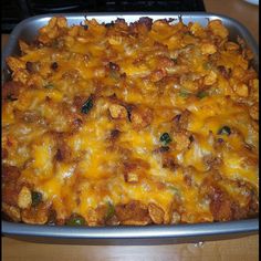 a casserole dish with cheese and chicken in it