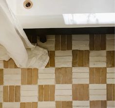 a bath tub sitting next to a white toilet