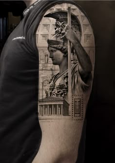 a man with a statue on his arm