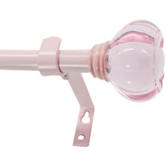 a pink curtain rod with a glass ball on it's end and a white background