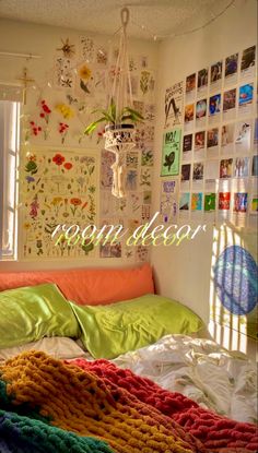 a bedroom with many pictures on the wall