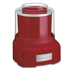 a red food processor sitting on top of a white table