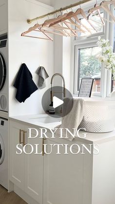 an image of a laundry room setting with dryer and washing machine in the foreground