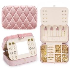 an open pink case with lots of jewelry in it