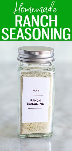 a jar filled with ranch seasoning sitting on top of a counter next to a green sign