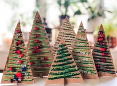 small christmas trees made out of brown paper