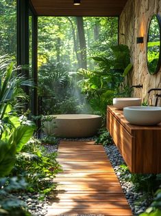 an outdoor bathroom with two sinks and large mirrors on the wall, surrounded by greenery