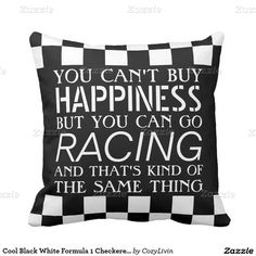 a black and white pillow that says you can't buy happiness but you can go racing