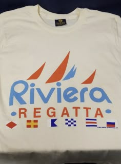 a white shirt with the words riviero regatta on it and flags