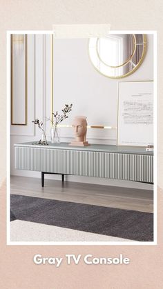 a tv console in front of a mirror with vases on it and the words gray tv console below