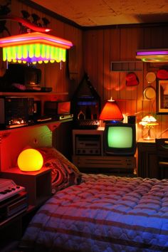 a bed room with a neatly made bed and two televisions