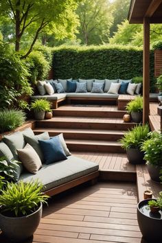 a wooden deck with lots of plants and couches