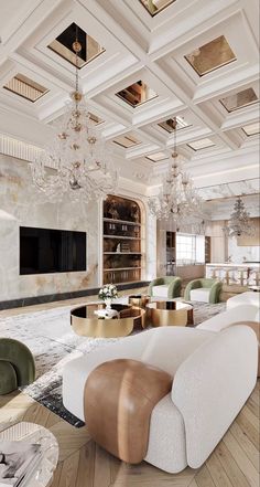 a large living room with white couches and chandeliers hanging from the ceiling