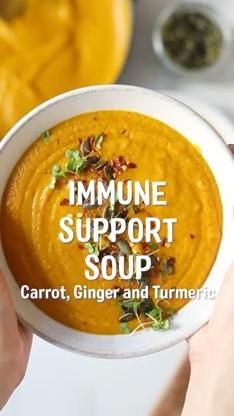 someone holding a bowl of carrot ginger and turment soup with the words, immune support soup