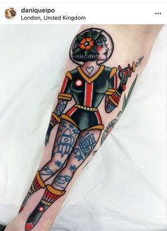 a person with a tattoo on their leg is holding a knife and wearing a helmet