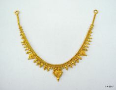 ethnic 20kt gold necklace choker from rajasthan india. great handmade design made of solid 20kt yellow gold. nice handmade design good for jewelry collection. Note - we provide adjustable cord to wear this necklace.   length - 21.2 cm(8.34") width max . - 2.2 cm(0.86") weight approx - 10.6 grams material - 20kt yellow gold. spj Note-All the items appear In Pictures larger than actual in size so please check measurements carefully before purchase. Traditional Gold Necklace, Yellow 22k Gold Temple Jewelry, 22k Gold Temple Jewelry In Yellow, 22k Yellow Gold Kundan Necklace With Latkans, 22k Gold Yellow Temple Jewelry, Traditional Yellow Gold Plated Temple Necklace, 20 Grams Gold Necklace Designs, Festival Yellow Temple Necklace, Yellow Gold 22k Temple Necklace For Festivals